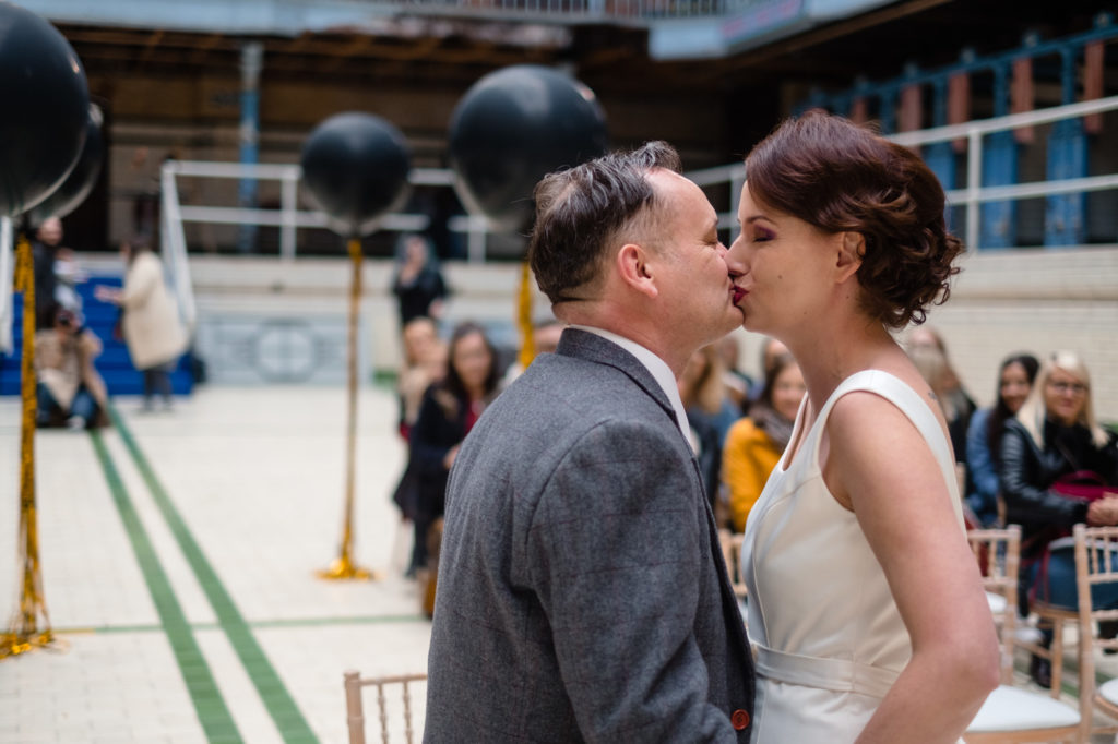 A Black, Gold & Purple Wedding at Victoria Baths with Vintage Embroidered Napkins