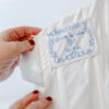 Personalised wedding dress label in silk with dusty blue embroidey