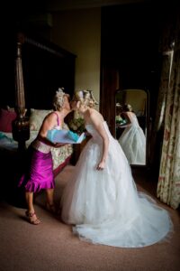 Bride with Mother of the bride morning of the wedding with personalised handkerchief